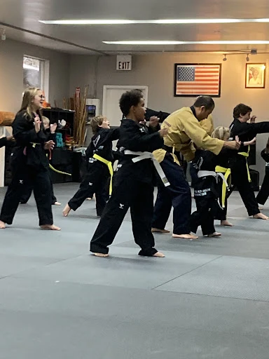 Students sharing a fist bump after class at Oh's Martial Arts in Seminole